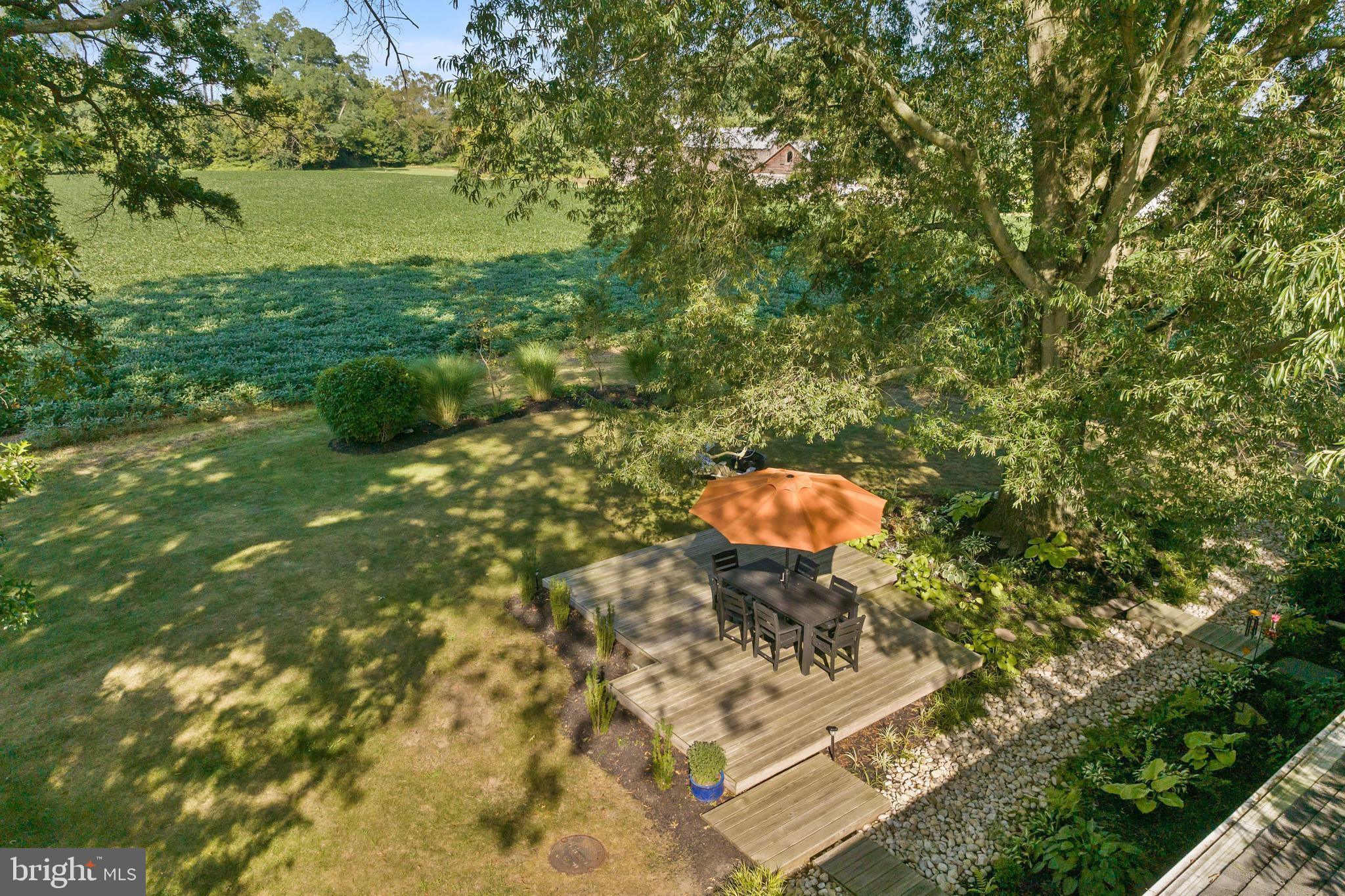 415 Ellisdale Road Chesterfield, NJ 08515 - Photo 46 of 47 a backyard of a house with table and chairs