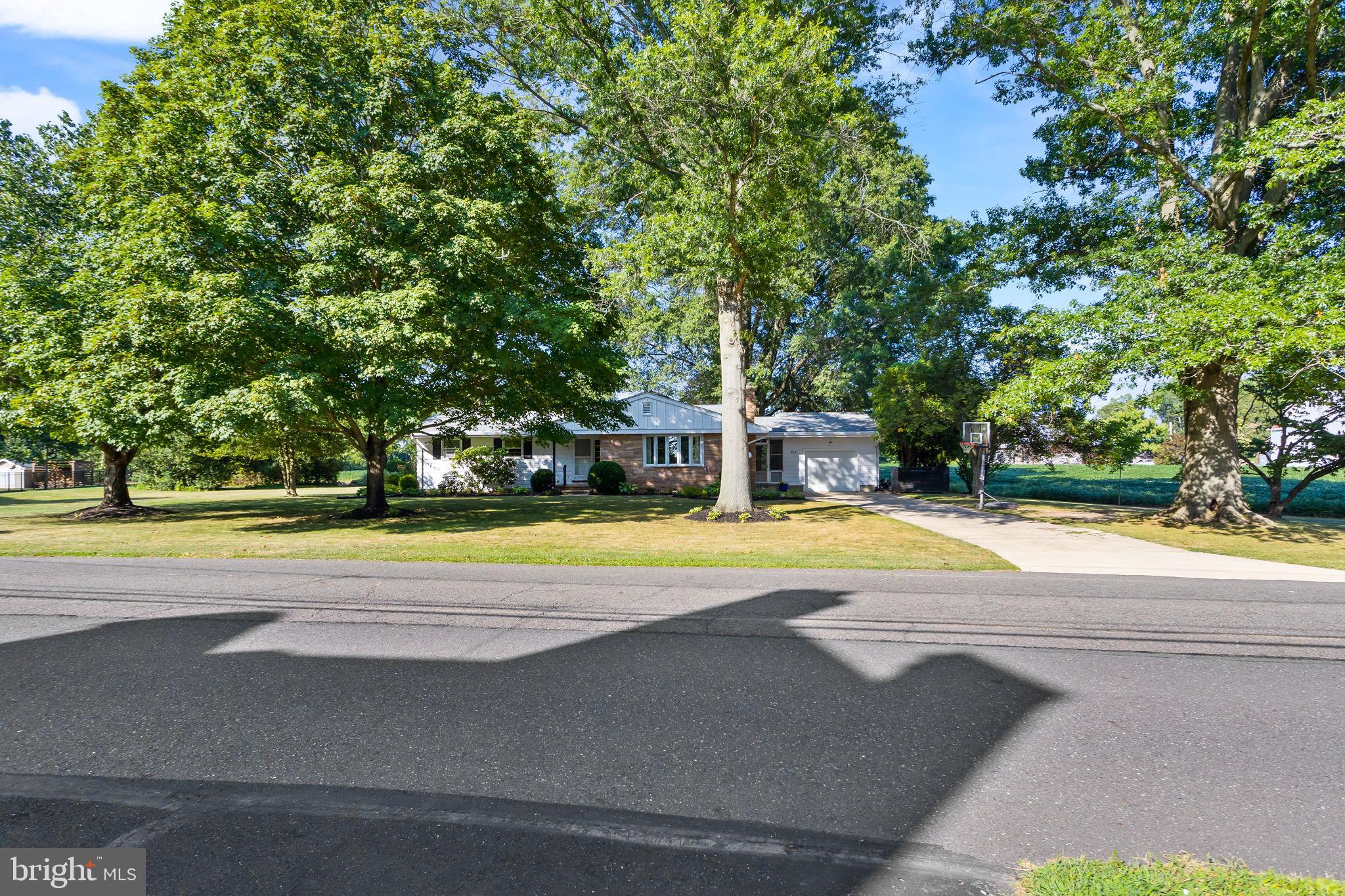 415 Ellisdale Road Chesterfield, NJ 08515 - Photo 47 of 47 a view of a swimming pool with an outdoor space and seating area