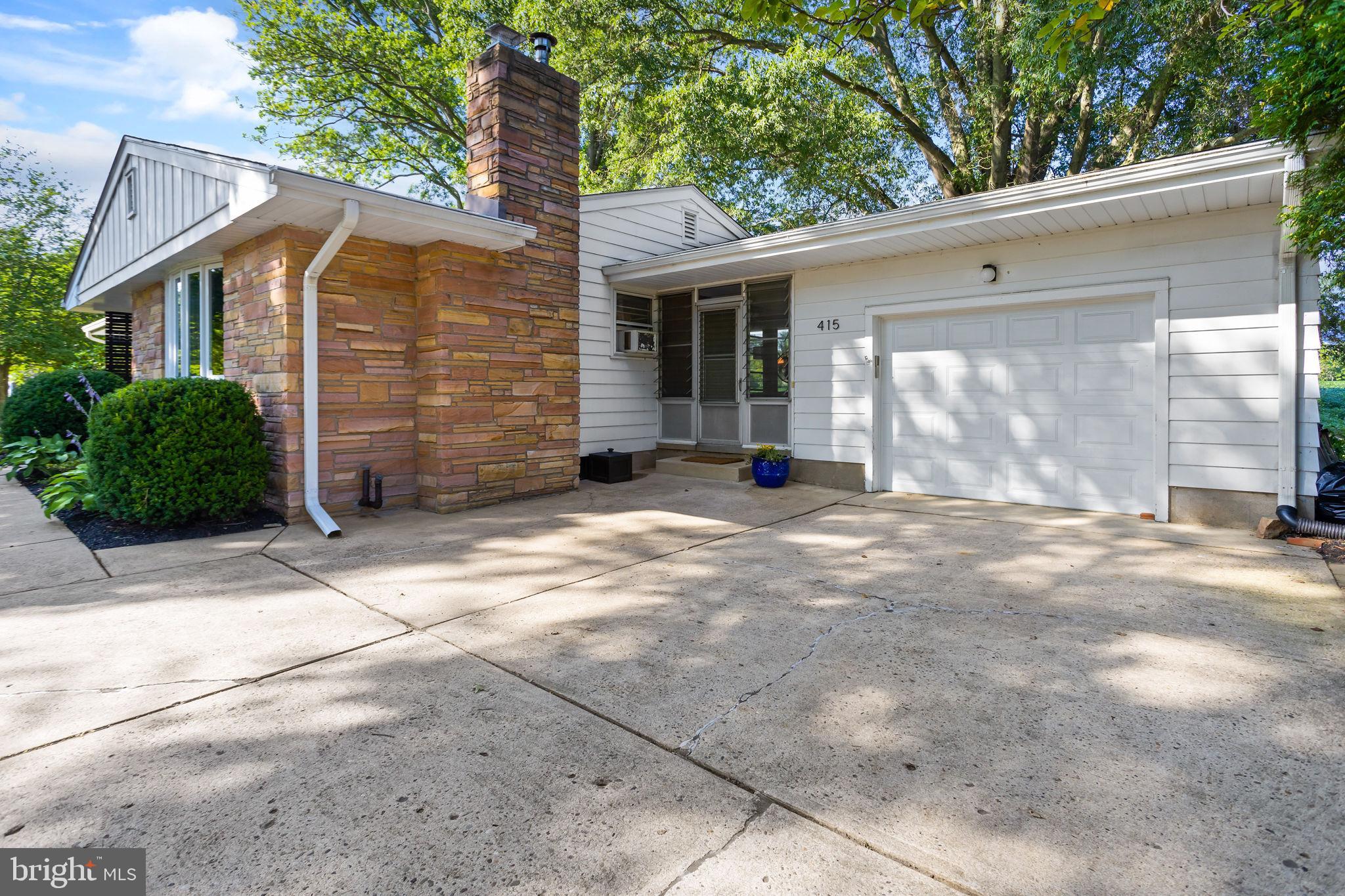 415 Ellisdale Road Chesterfield, NJ 08515 - Photo 6 of 47 a view of a house with a backyard and windows