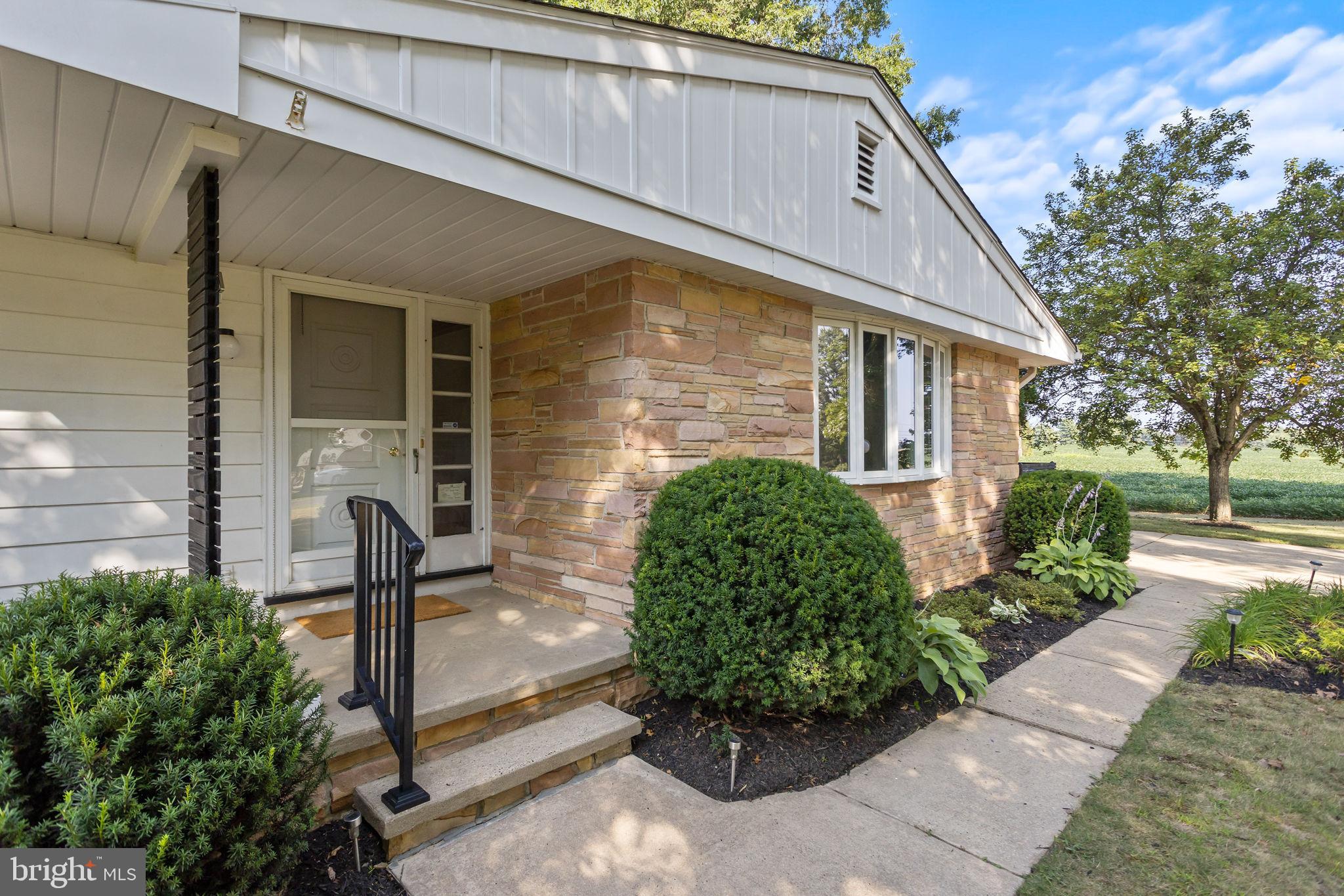 415 Ellisdale Road Chesterfield, NJ 08515 - Photo 7 of 47 a front view of a house with garden