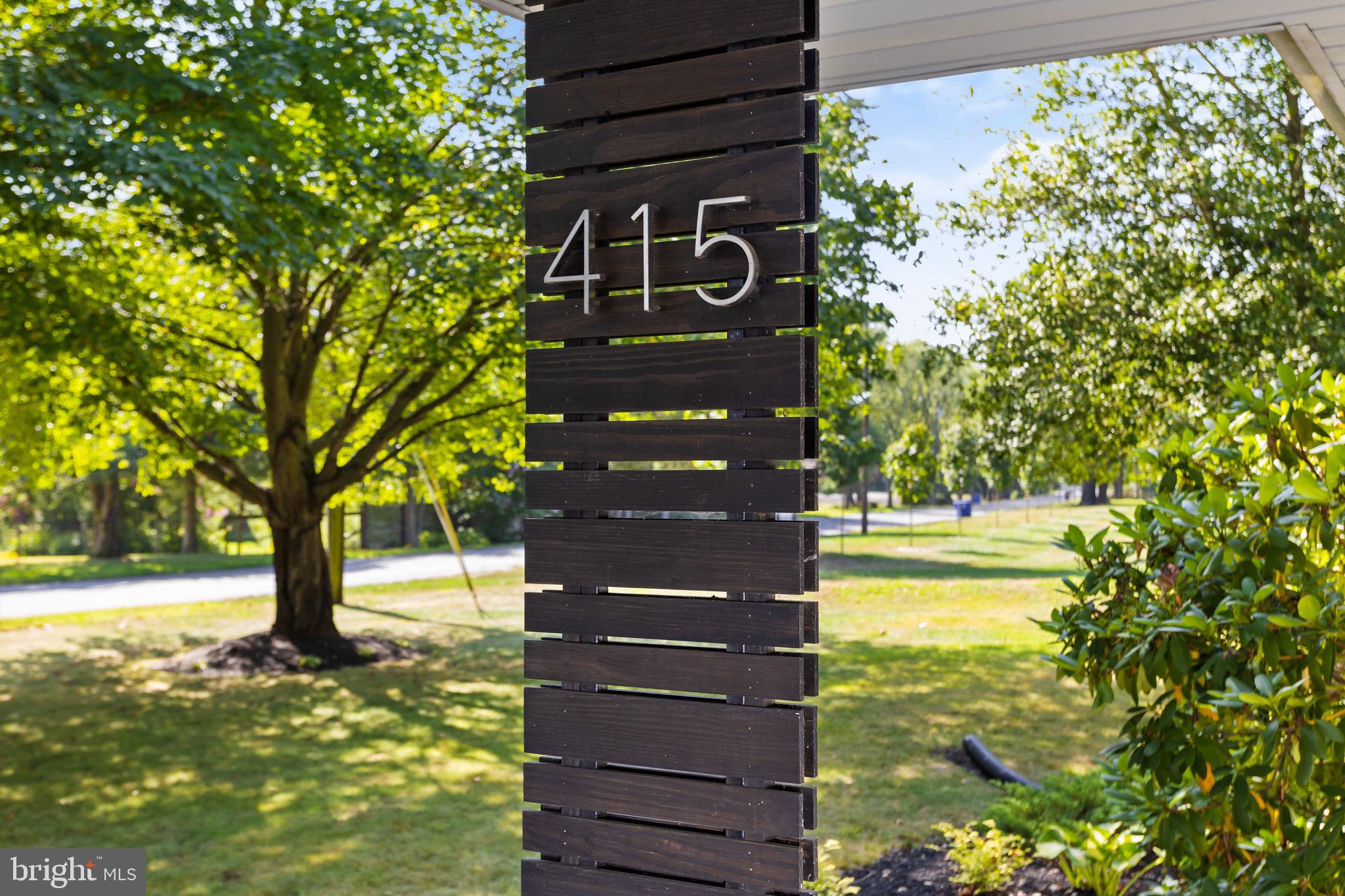 415 Ellisdale Road Chesterfield, NJ 08515 - Photo 8 of 47 a view of a street sign of a building