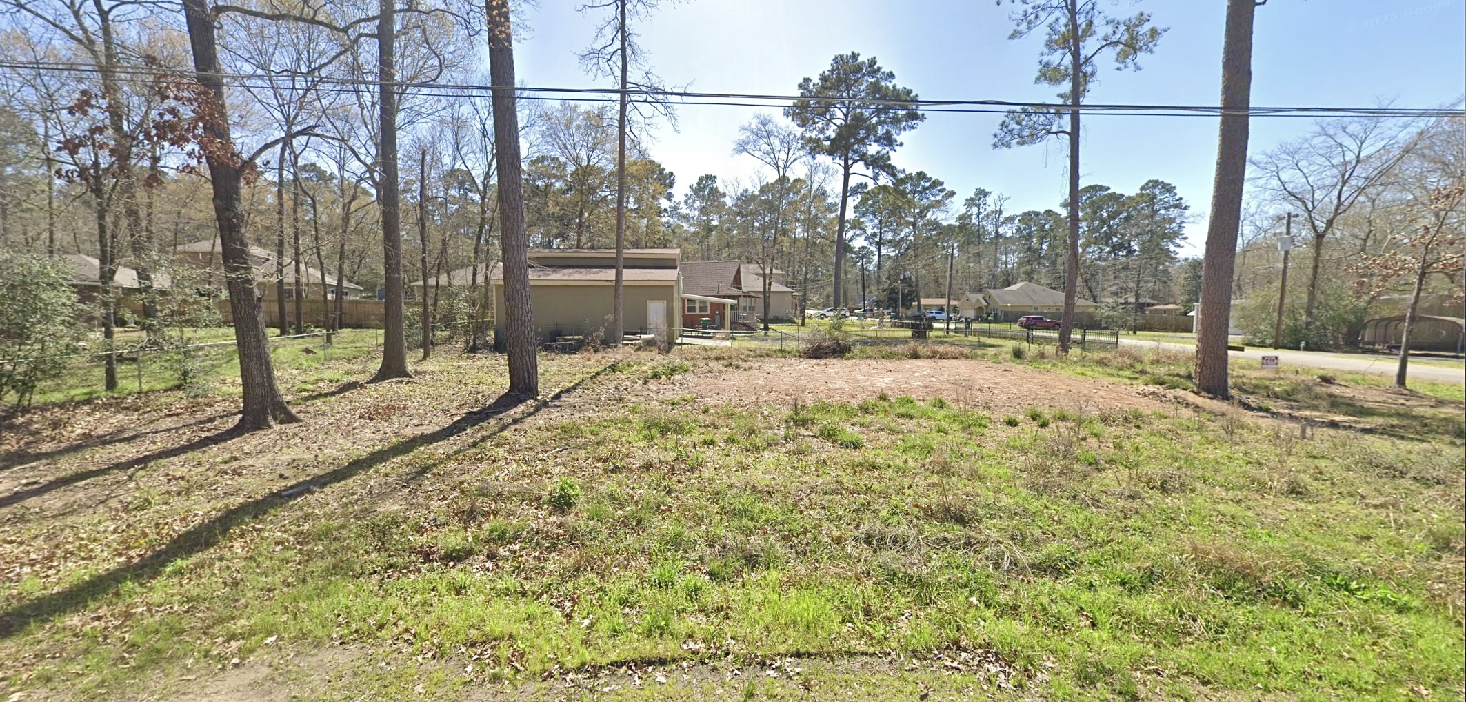 1103 Yellowstone River Road Conroe, TX 77316 - Photo 11 of 12 a view of a yard with a tree
