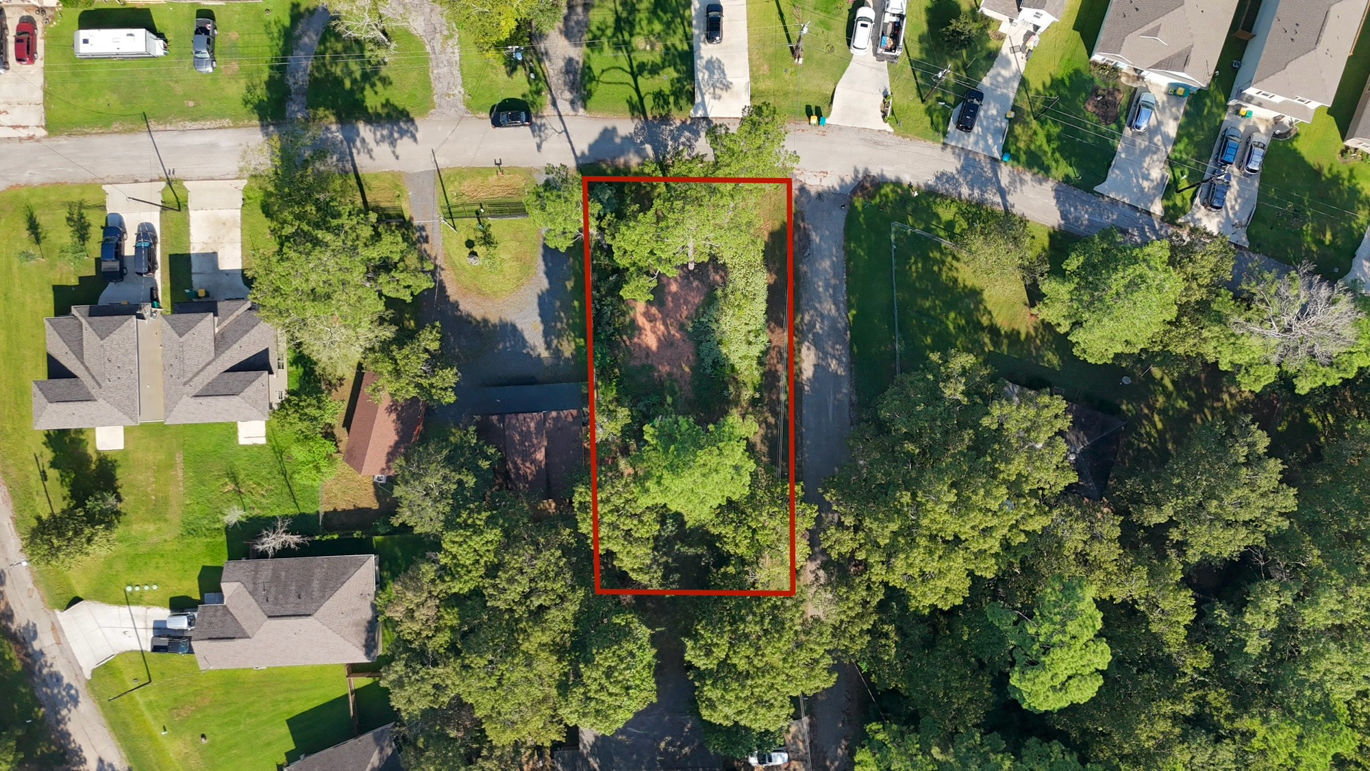 1103 Yellowstone River Road Conroe, TX 77316 - Photo 4 of 12 an aerial view of a house with a yard and garden