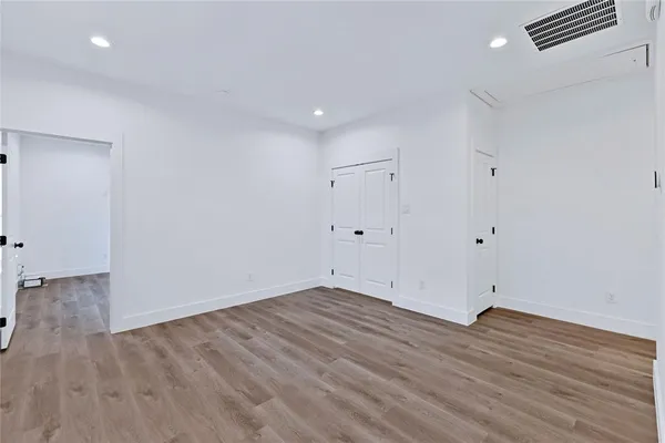 a view of room with wooden floor