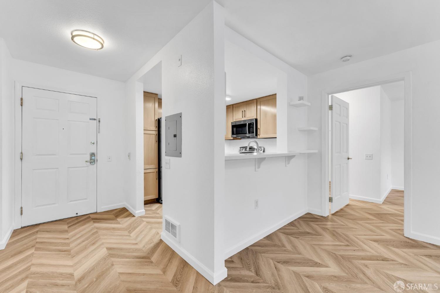 555 10th Street, Unit 102 Oakland, CA 94607 - Photo 14 of 38 a view of a bedroom with wooden floor