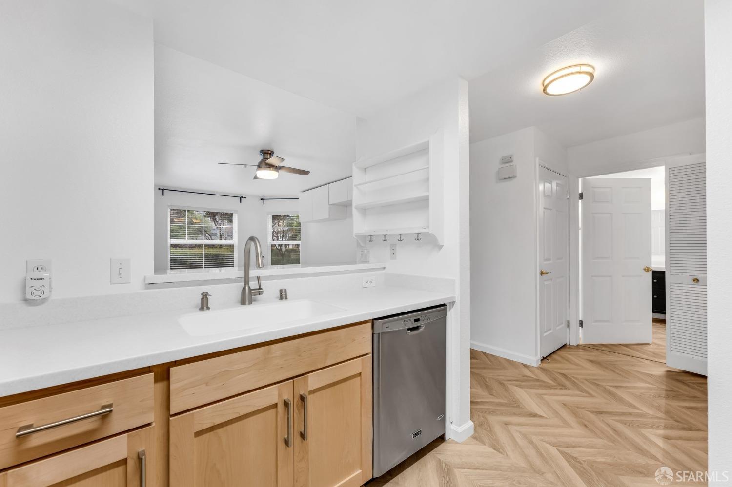 555 10th Street, Unit 102 Oakland, CA 94607 - Photo 15 of 38 a bathroom with a sink and a mirror
