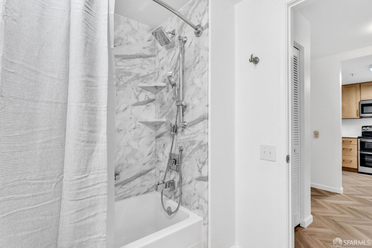 555 10th Street, Unit 102 Oakland, CA 94607 - Photo 18 of 38 a bathroom with a shower