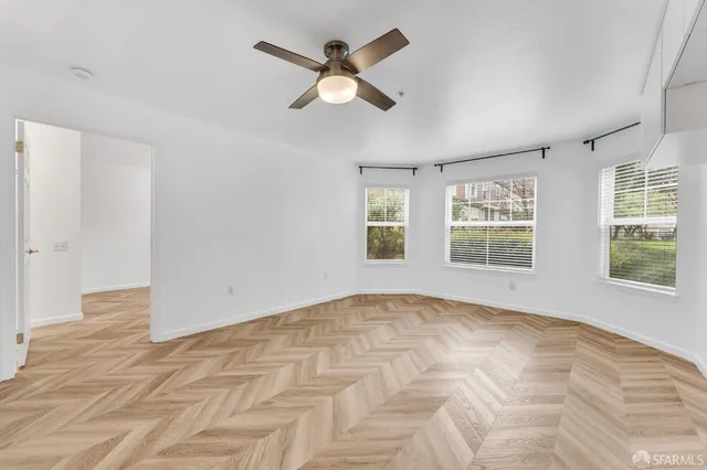 a view of an empty room with a window