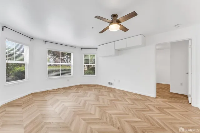 a view of an empty room with a window