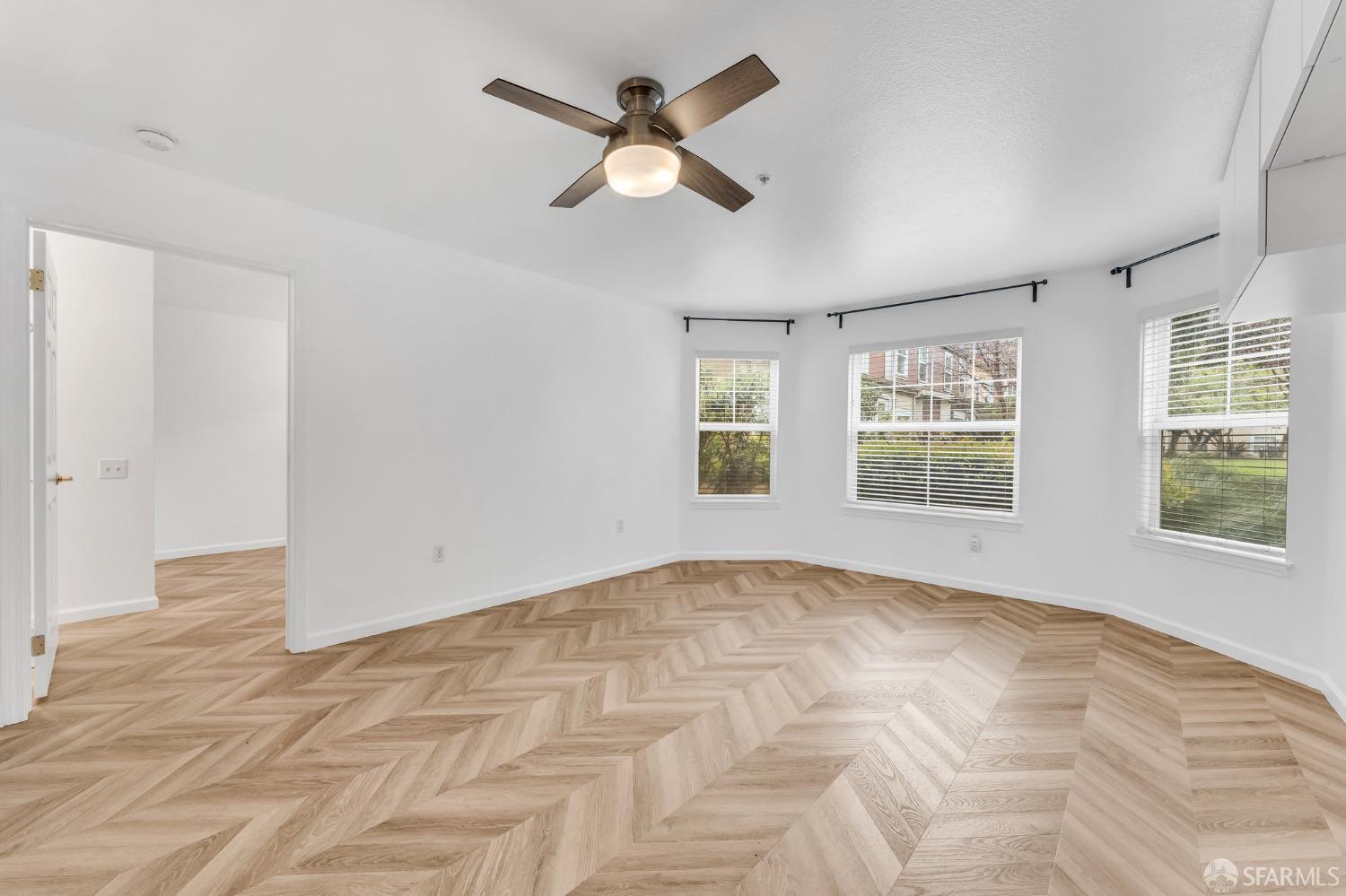 555 10th Street, Unit 102 Oakland, CA 94607 - Photo 10 of 38 a view of an empty room with a window