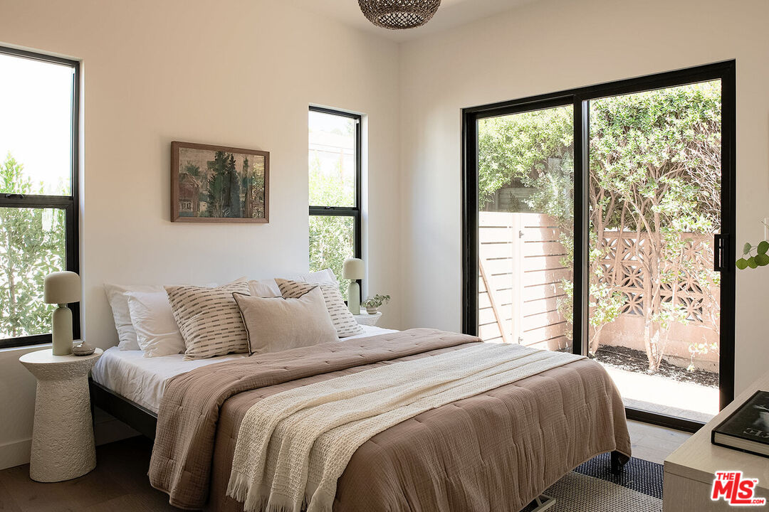 5117 Coringa Drive Los Angeles, CA 90042 - Photo 15 of 27 a bedroom with a bed and a window