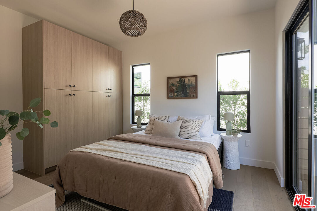 5117 Coringa Drive Los Angeles, CA 90042 - Photo 17 of 27 a bedroom with a bed and a window