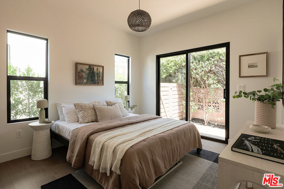 5117 Coringa Drive Los Angeles, CA 90042 - Photo 18 of 27 a bedroom with a bed and a window