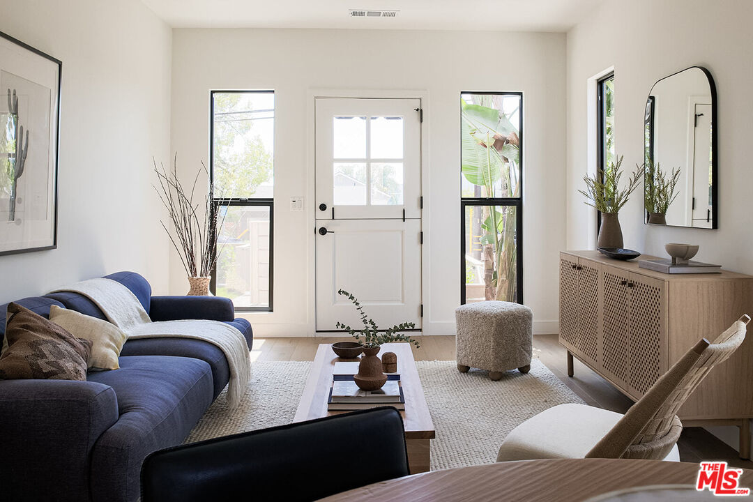 5117 Coringa Drive Los Angeles, CA 90042 - Photo 4 of 27 a living room with furniture and a large window