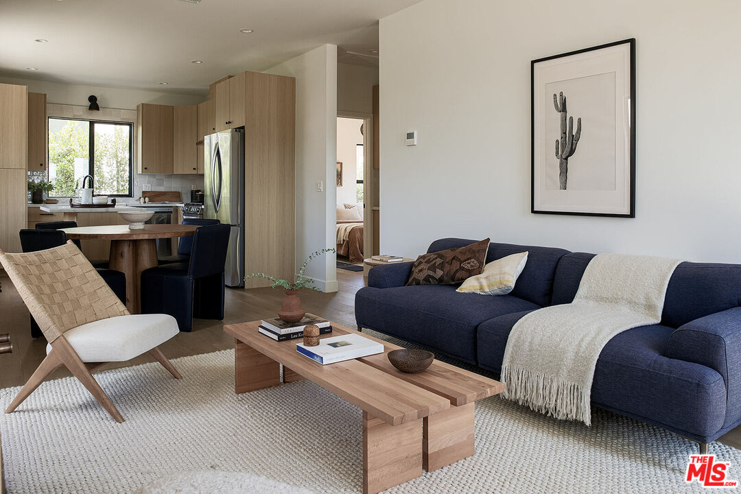 5117 Coringa Drive Los Angeles, CA 90042 - Photo 6 of 27 a living room with furniture and a large window