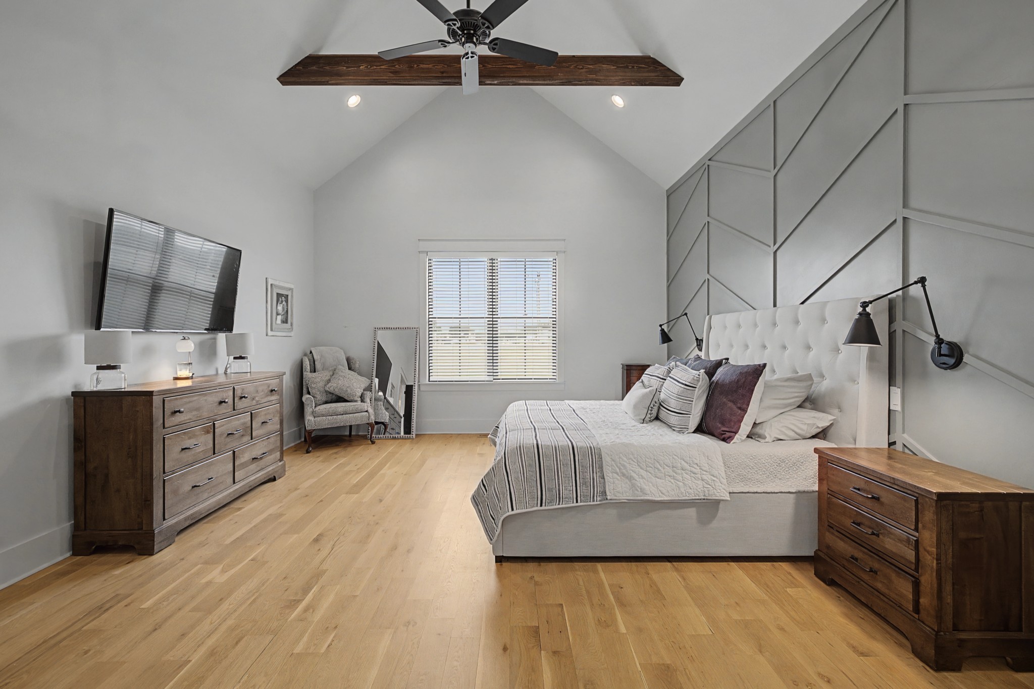 110 Squire Jones Road Bell Buckle, TN 37020 - Photo 27 of 50 a bedroom with a bed and a flat tv screen on the dresser