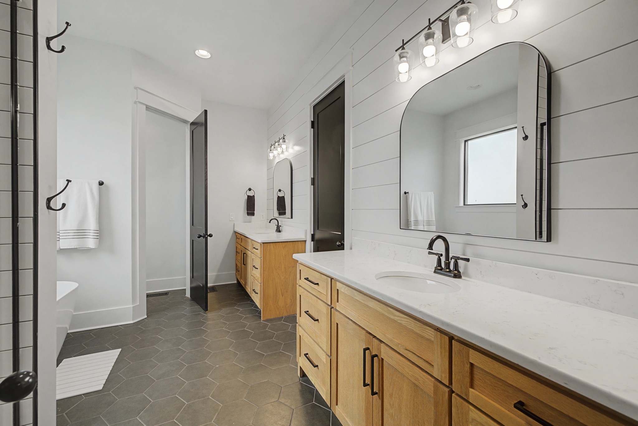 110 Squire Jones Road Bell Buckle, TN 37020 - Photo 30 of 50 a spacious bathroom with a double vanity sink a mirror and a shower