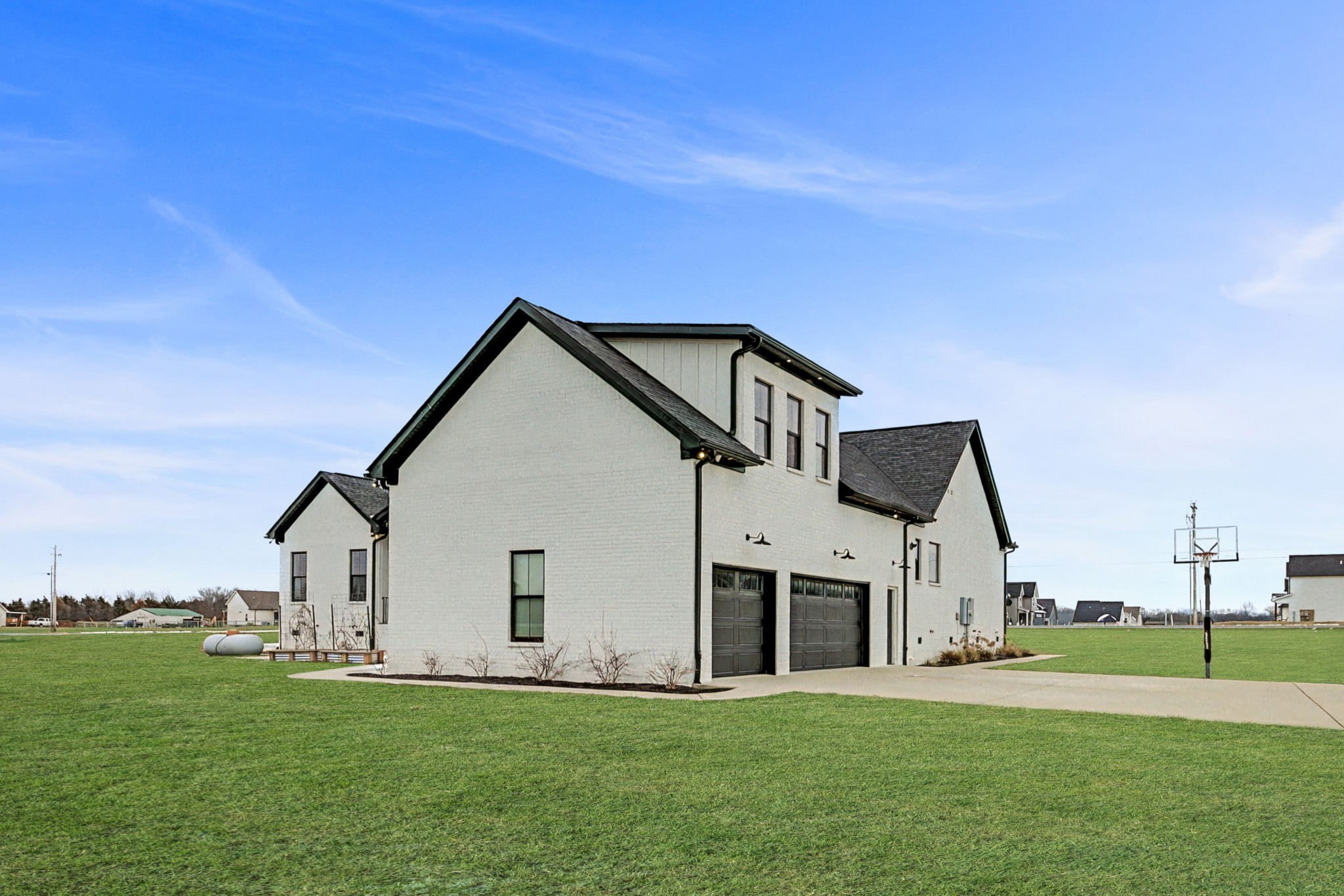 110 Squire Jones Road Bell Buckle, TN 37020 - Photo 49 of 50 a front view of a house with a yard and garage