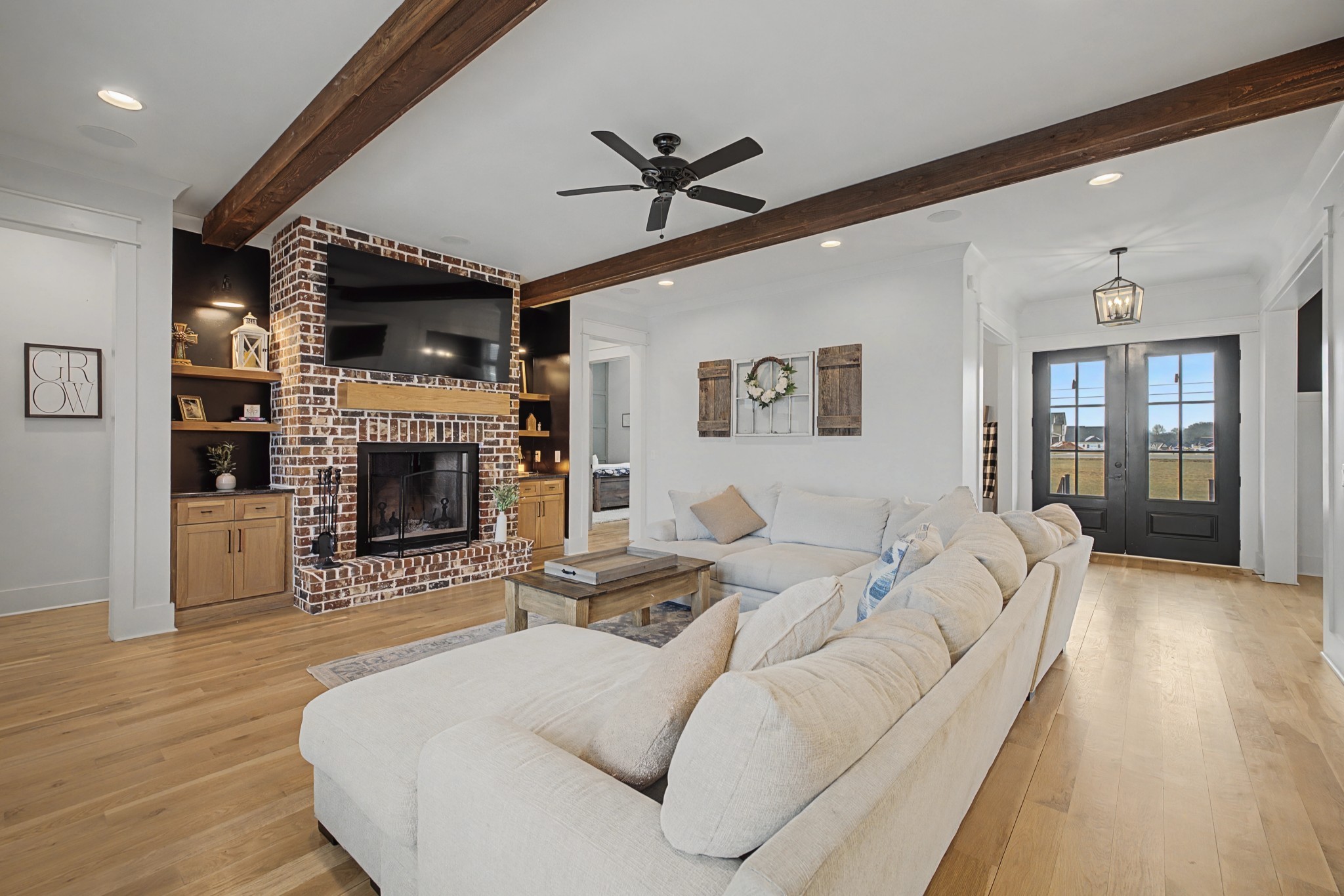 110 Squire Jones Road Bell Buckle, TN 37020 - Photo 8 of 50 a living room with furniture a fireplace and a flat screen tv