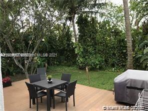 9132 Froude Avenue Surfside, FL 33154 - Photo 12 of 22 a view of a table and chairs in the garden