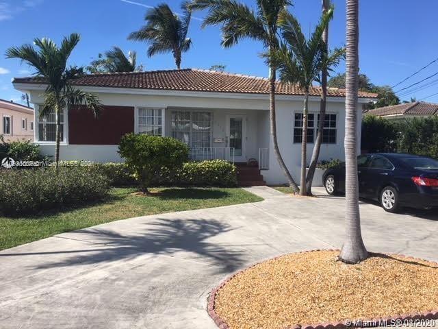 9132 Froude Avenue Surfside, FL 33154 - Photo 19 of 22 a front view of a house with garden