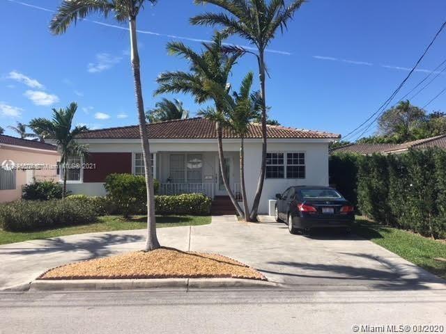 9132 Froude Avenue Surfside, FL 33154 - Photo 2 of 22 a house with a garden space
