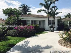 9132 Froude Avenue Surfside, FL 33154 - Photo 21 of 22 a front view of a house with a garden