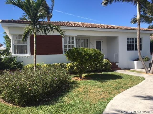 9132 Froude Avenue Surfside, FL 33154 - Photo 22 of 22 a front view of a house with a yard
