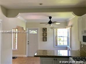 9132 Froude Avenue Surfside, FL 33154 - Photo 7 of 22 a view of a hallway with windows