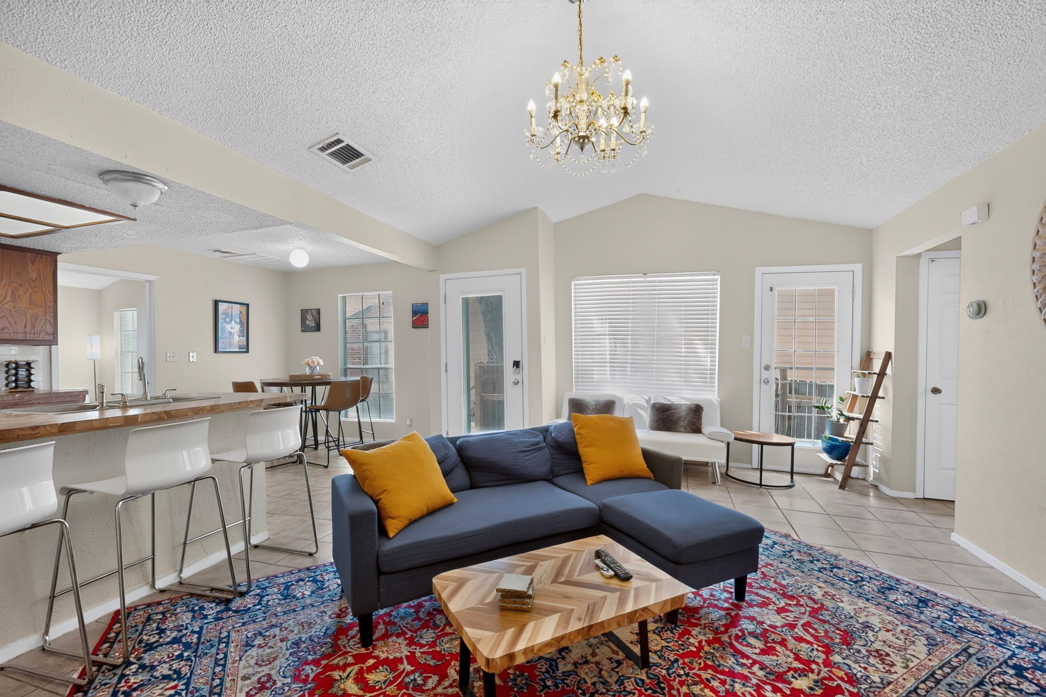 1602 Waterloo Trail, Unit B Austin, TX 78704 - Photo 30 of 31 An open floorplan connects the living spaces under vaulted ceilings with durable tile flooring.