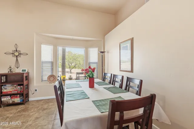 a view of a dining room with furniture window and outside view
