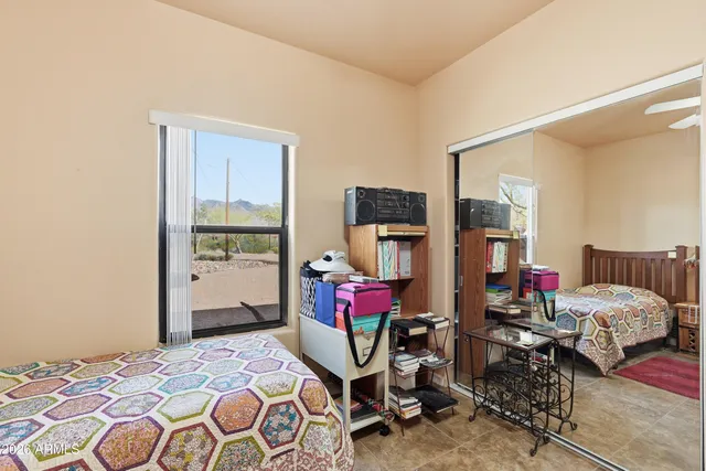 a bedroom with bed and a window