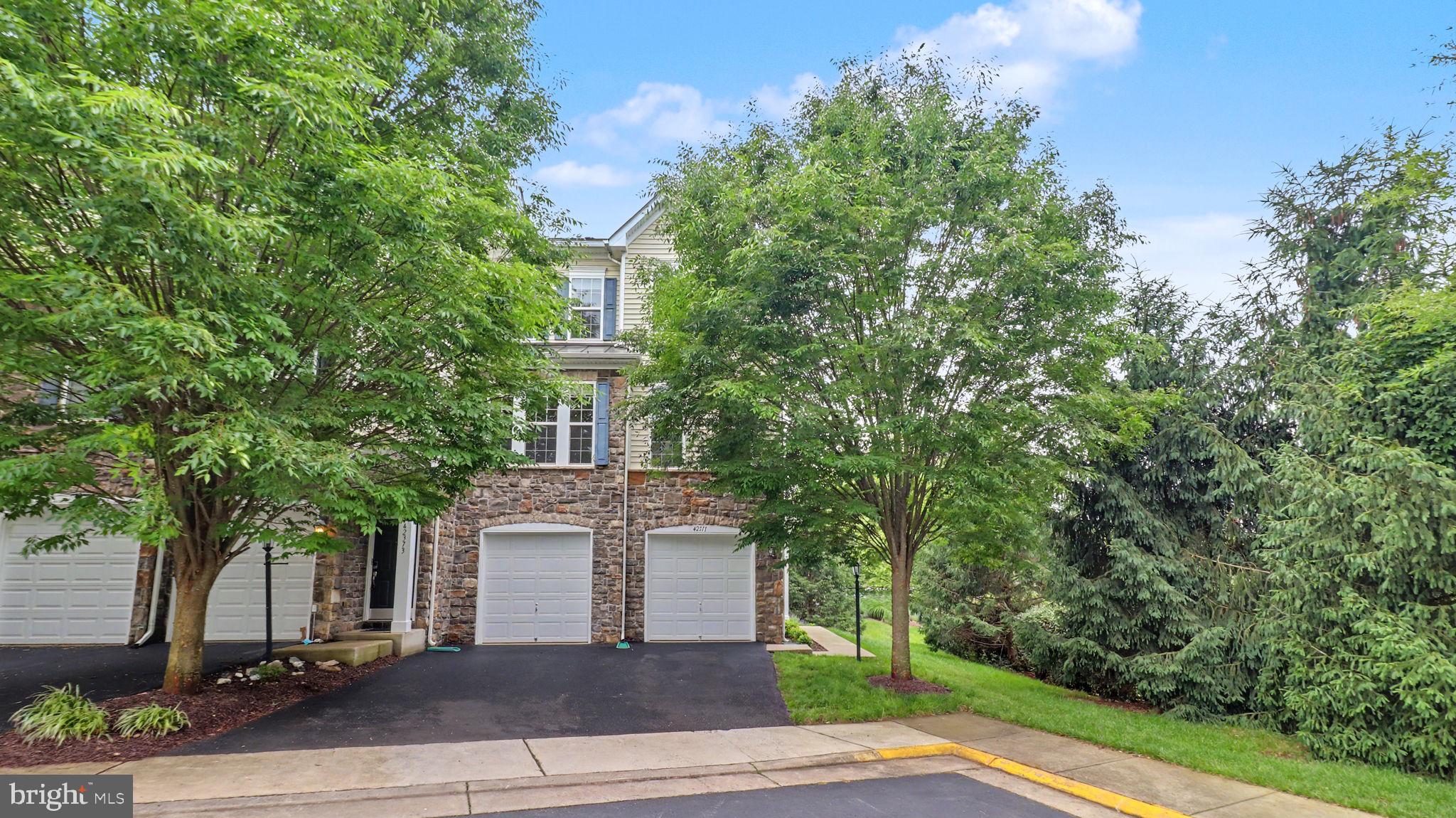 42371 Trellis Square Brambleton, VA 20148 - Photo 1 of 70 Charming home embraced by greenery.
