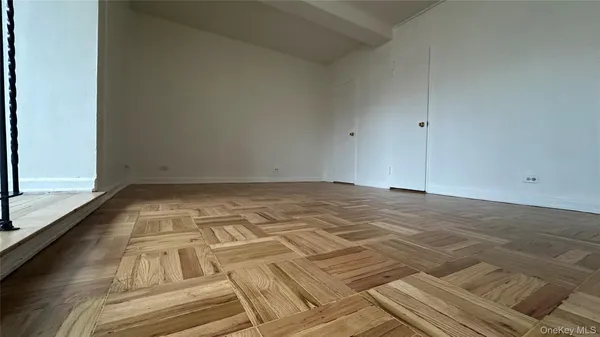 a view of a balcony with wooden floor