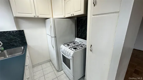 a kitchen with a sink and washing machine