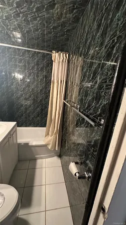 a bathroom with a toilet and a sink