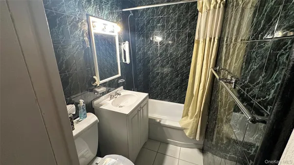 a bathroom with a sink and toilet