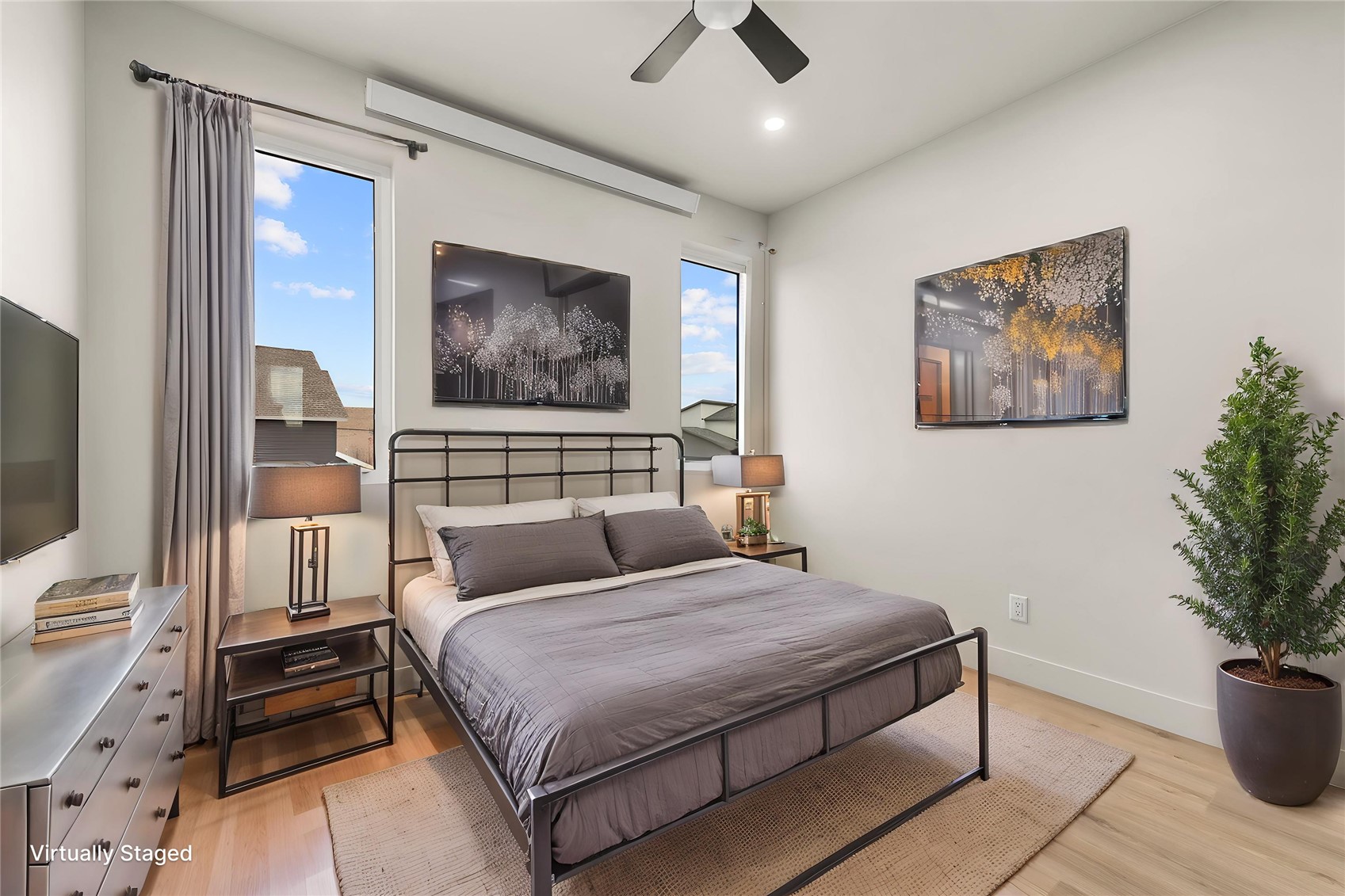 890 Dry Creek Road Hayden, CO 81639 - Photo 29 of 38 a bedroom with a bed and a painting on the wall