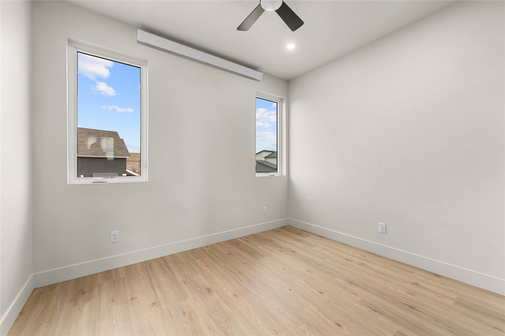 890 Dry Creek Road Hayden, CO 81639 - Photo 30 of 38 an empty room with a window and a ceiling fan