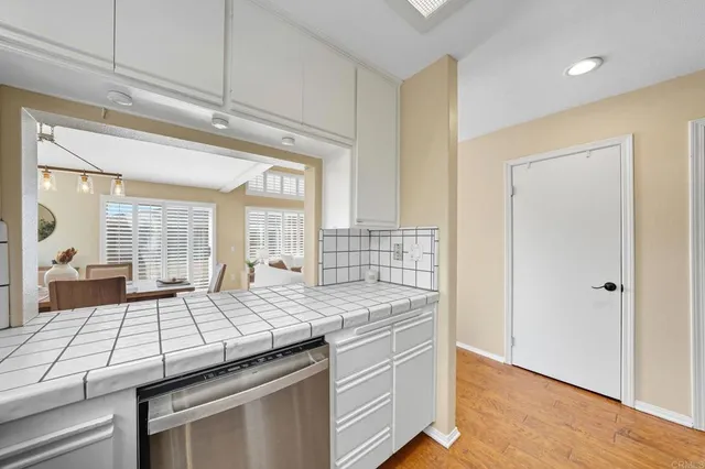a kitchen with a stove and a refrigerator