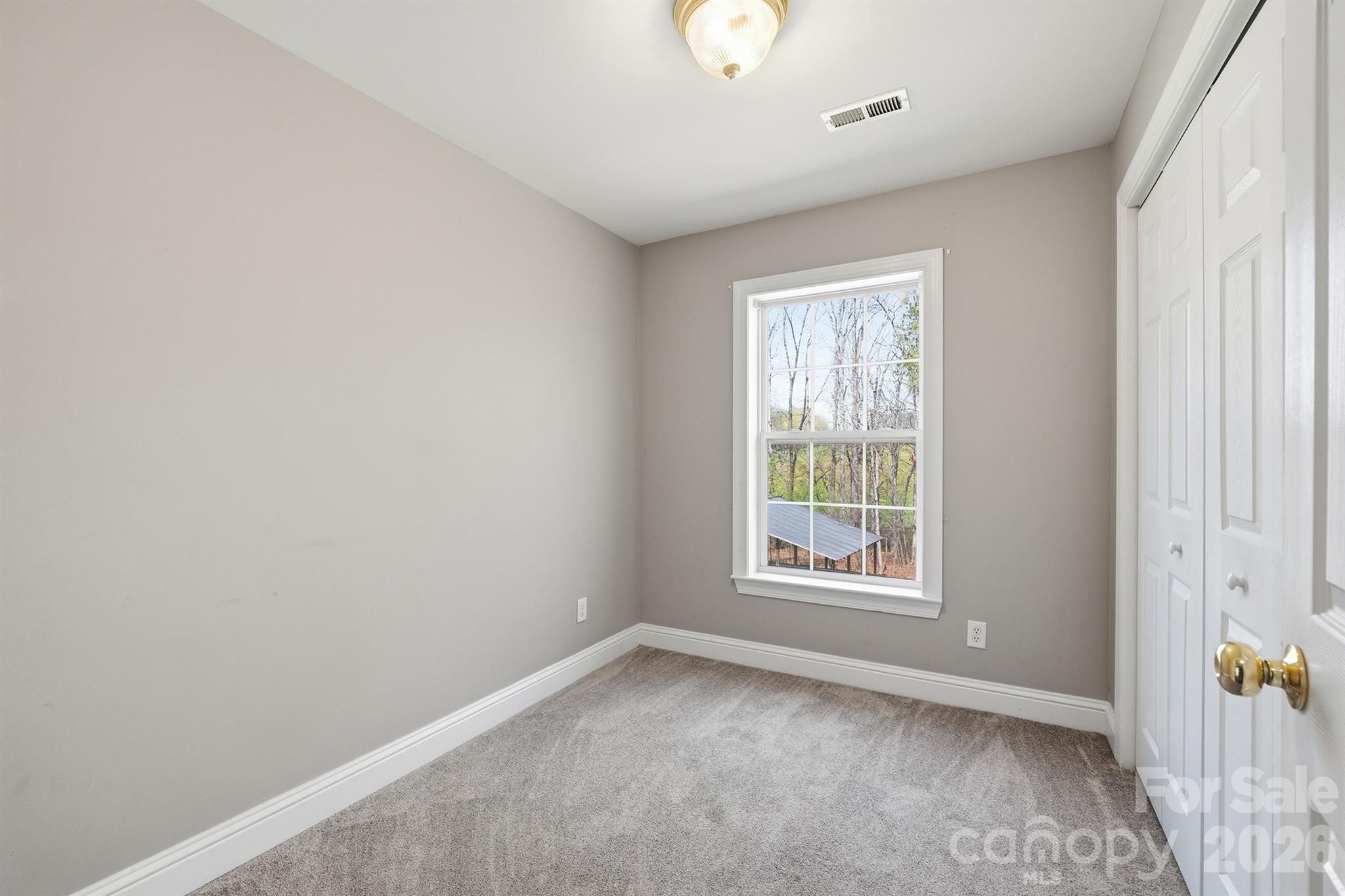 193 Red Hawk Lane Olin, NC 28660 - Photo 17 of 36 an empty room with windows