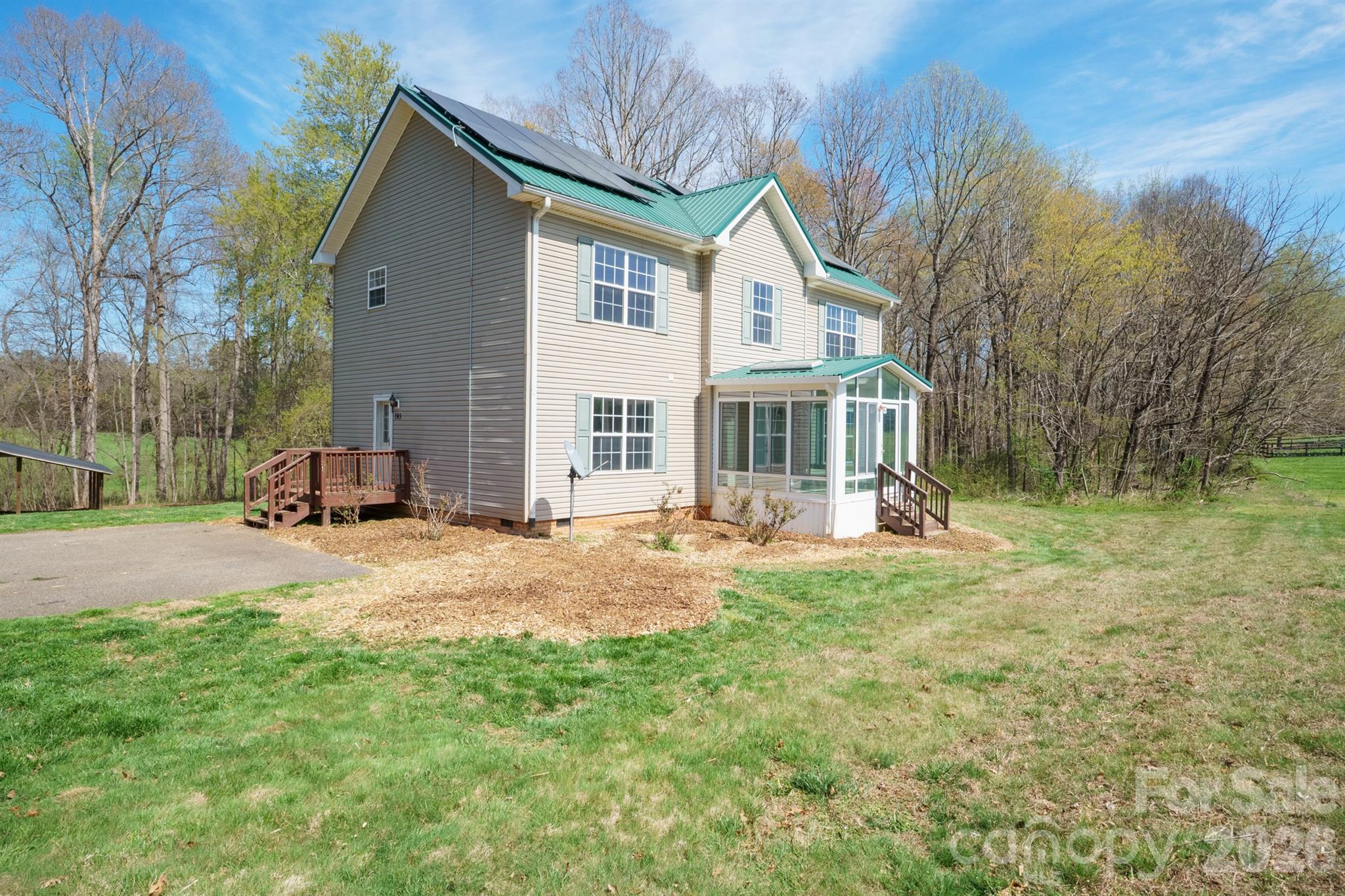 193 Red Hawk Lane Olin, NC 28660 - Photo 23 of 36 a view of a house with backyard and sitting area