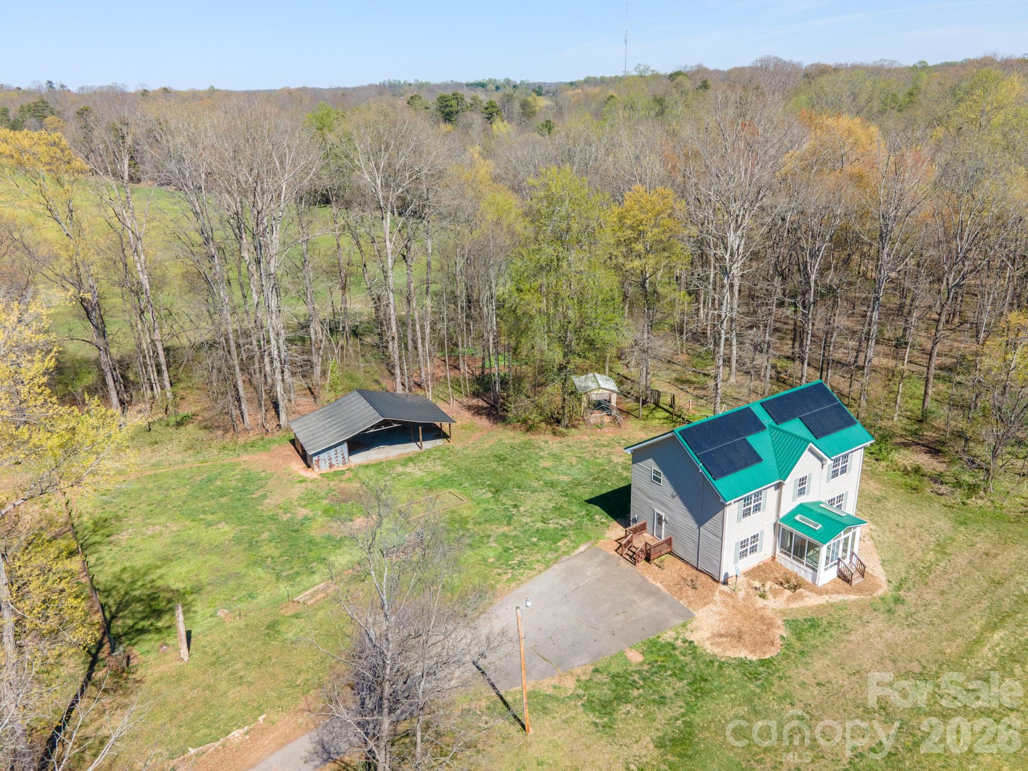 193 Red Hawk Lane Olin, NC 28660 - Photo 34 of 36 a view of a house with a yard and sitting area