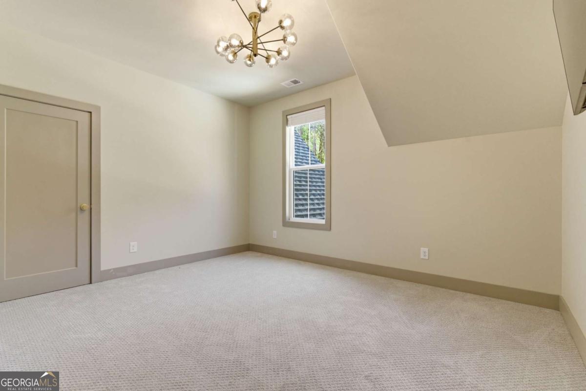 1315 Sandy Creek Road Tyrone, GA 30290 - Photo 95 of 100 a view of an empty room with a window