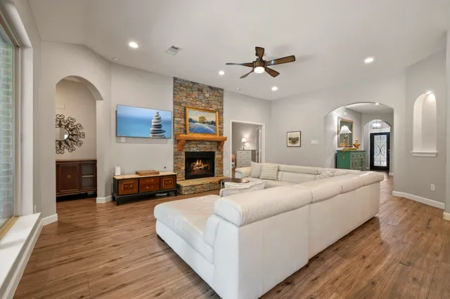 a living room with furniture and a fireplace