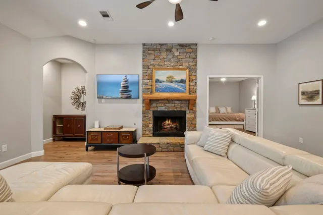 a living room with furniture and a fireplace