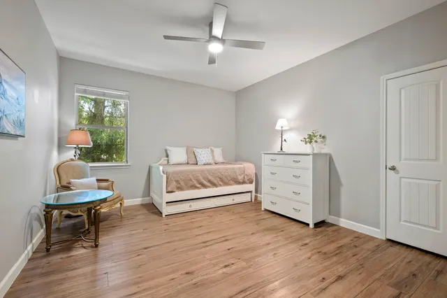 a bedroom with a bed and a table in it