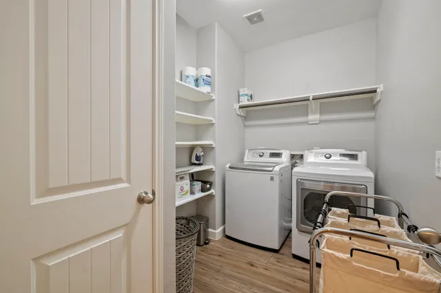 a view of storage and utility room with washer and dryer