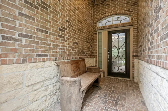 a bathroom with a granite countertop bathtub and a shower