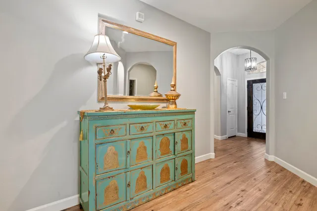 a view of hall way with furniture